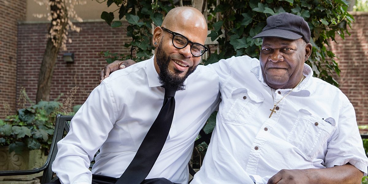 Two men sitting on a park bench